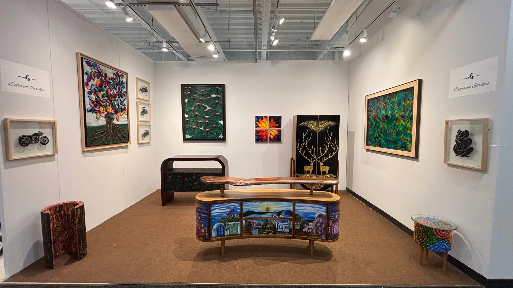 The Different Strokes booth M-5025 at High Point Market, with painted consoles, cabinets and wall art